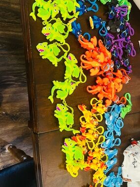 Colorful Silicone Dinosaur Keychain Toy - Green, Orange, Yellow, Blue around 80